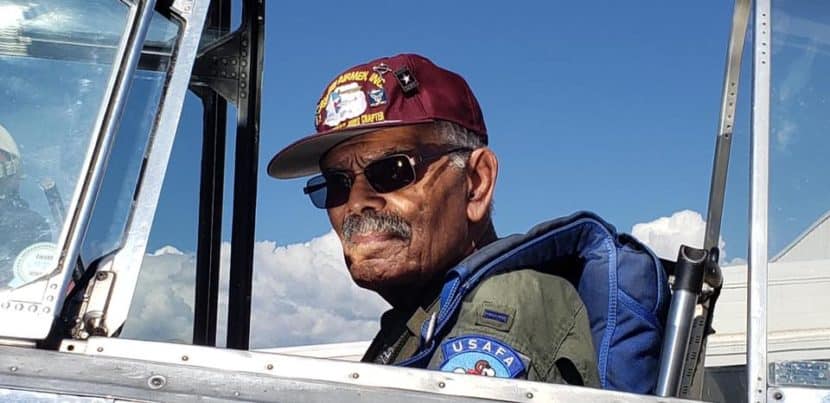 Frank Macon sitting in the cockpit of a T-6 Texan airplane before takeoff.