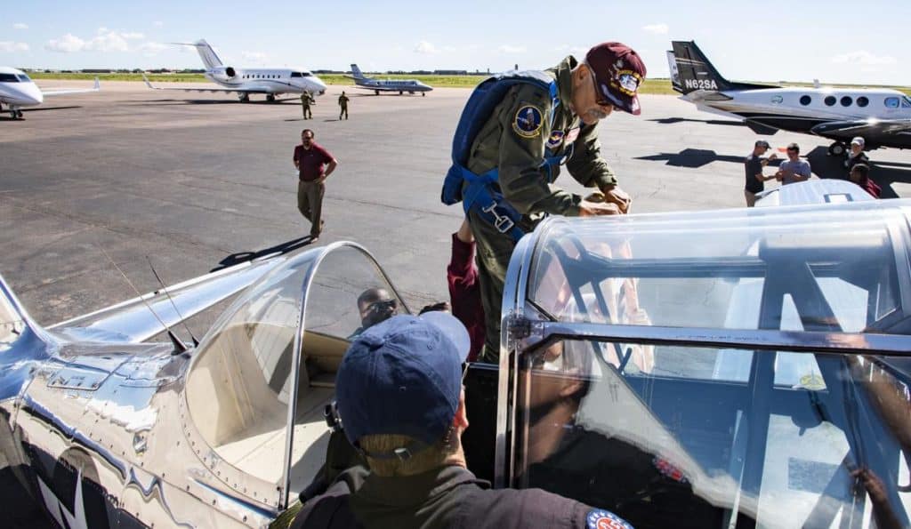 Frank climbing into the T-6 Texan Airplane